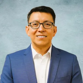 photo of H. Villarreal in blue jacket and white shirt